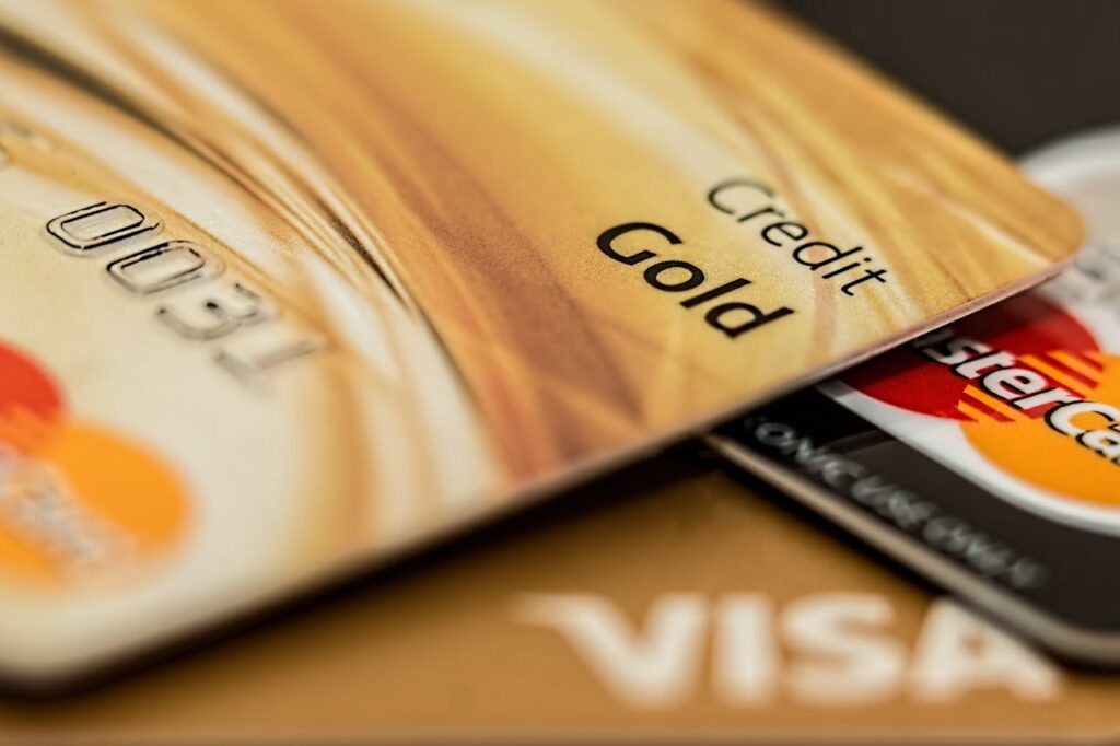 pexels-photo-164501 Stack of various branded credit cards focusing on gold card showing finance and cashless concept.